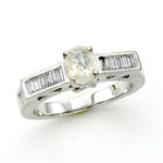 18KT WG BAGUETTE AND OVAL DIAMOND RING